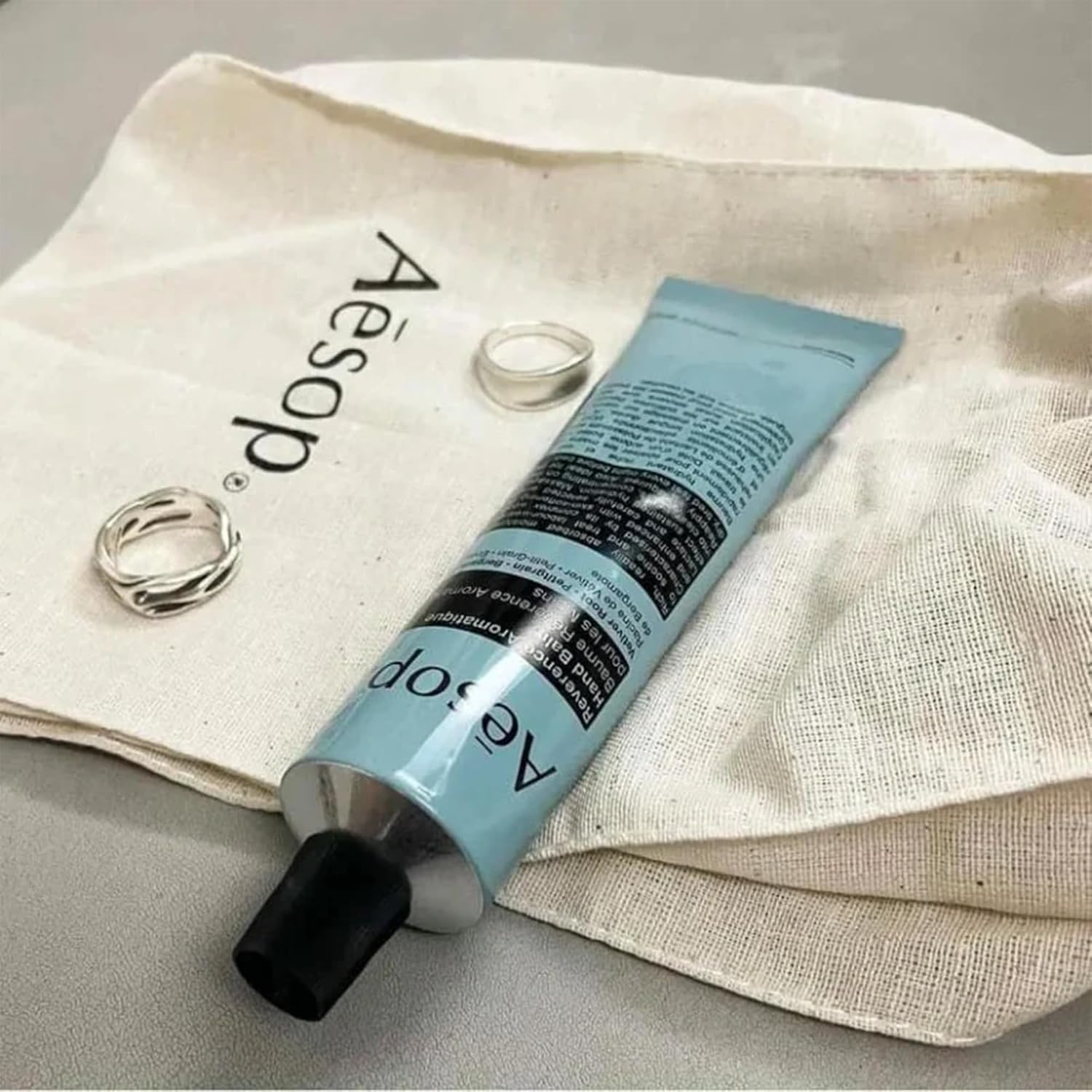 Aesop Reverence Aromatique Travel Size Hand Balm | Lotion that Gently Exfoliates Dry Hands + Nourishes with Macadamia Seed Oil and Shea Butter | 2.4 oz / 75 mL (Pack of 2)